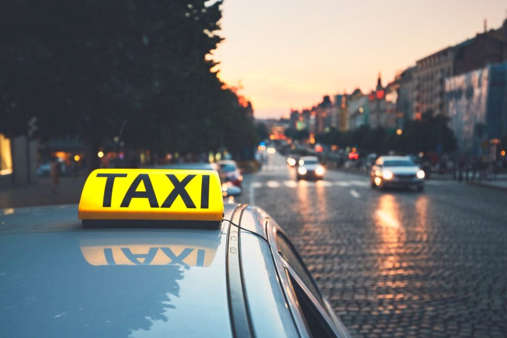 taxi-car-on-the-city-street-1536x1024
